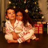 Small Folk Pyjamas - Brother & Sister cuddling in their pyjamas