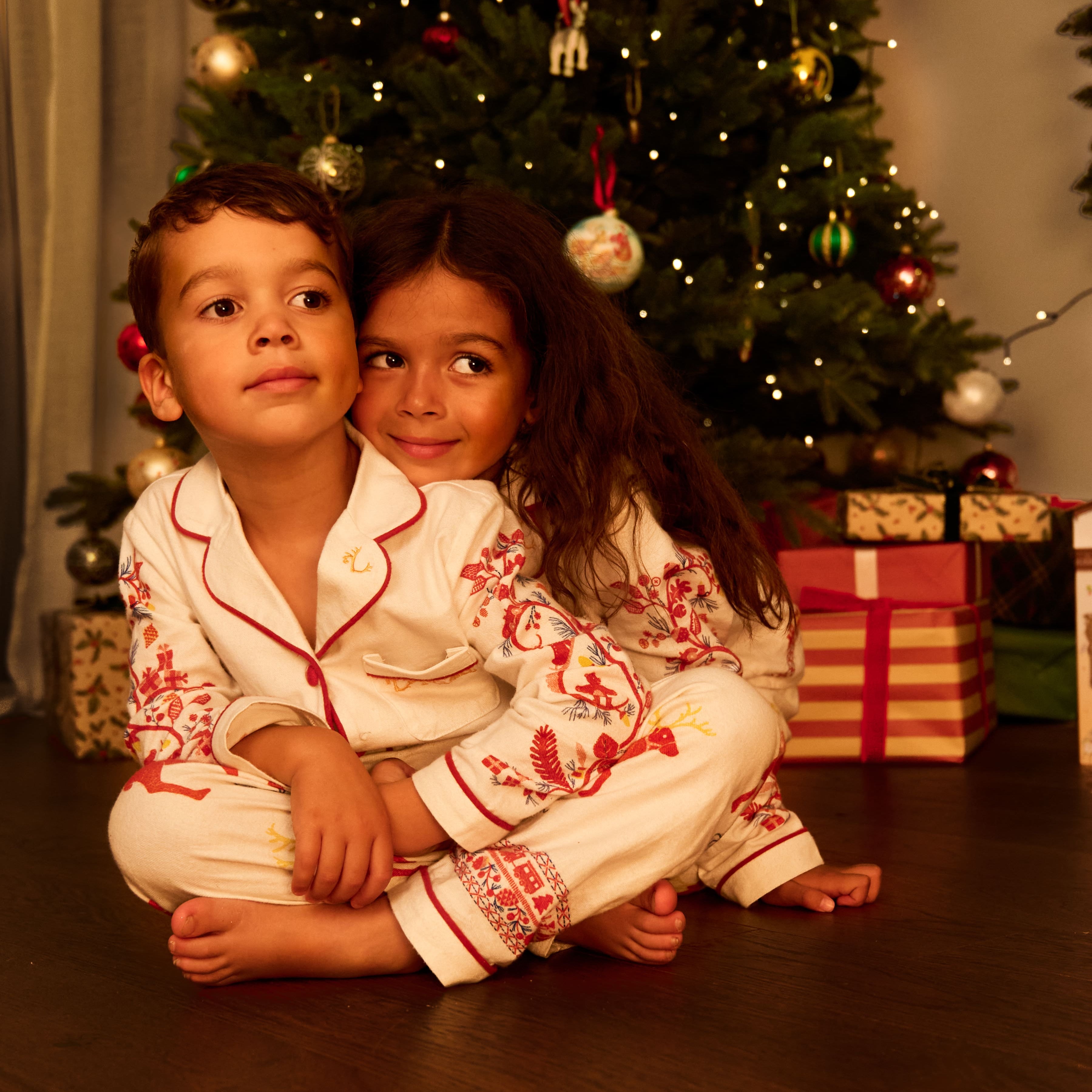 Small Folk Pyjamas - Brother & Sister cuddling in their pyjamas