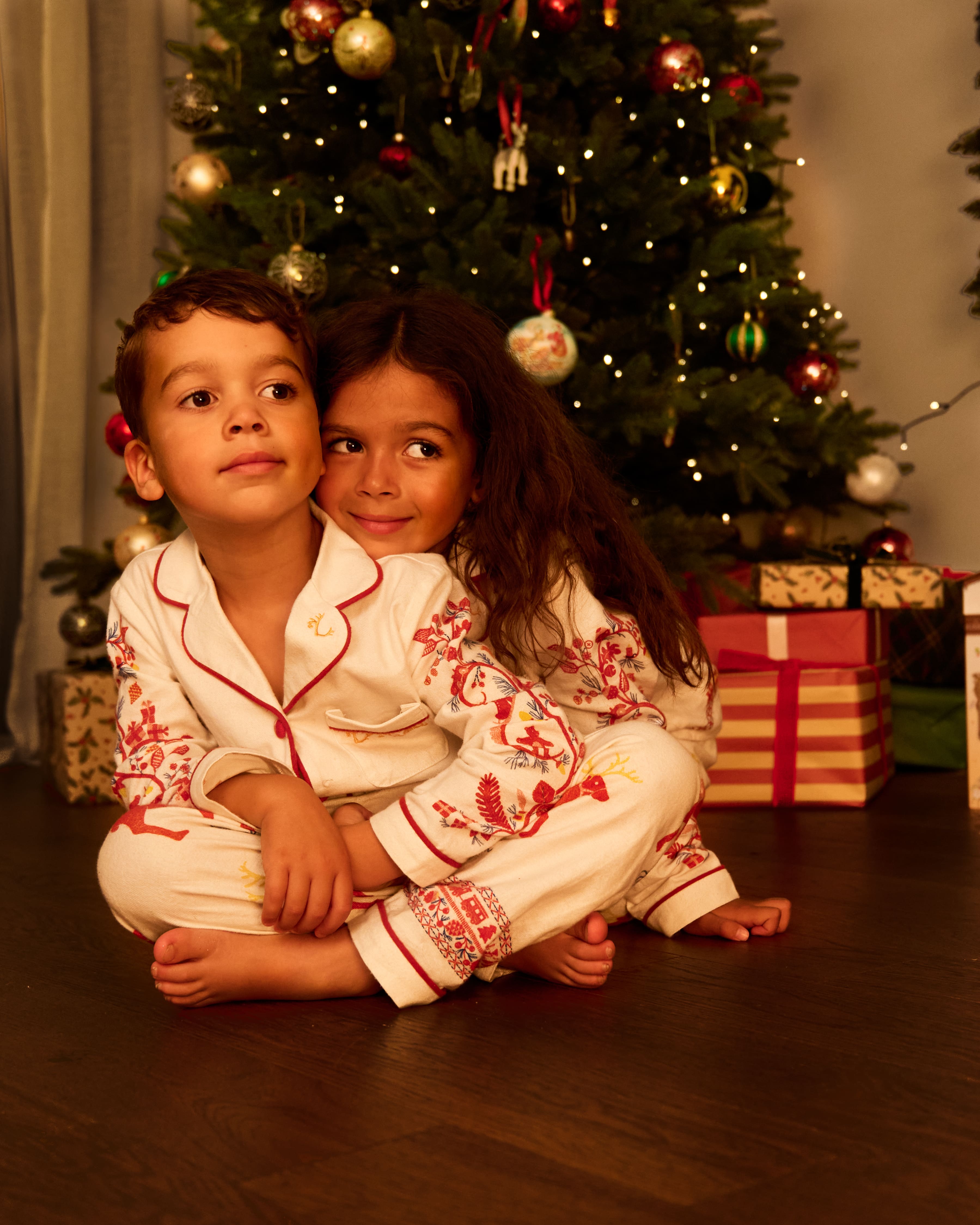Small Folk Pyjamas - Brother & Sister cuddling in their pyjamas