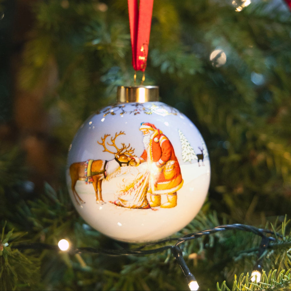 Father Christmas Feeding Reindeer Ceramic Bauble